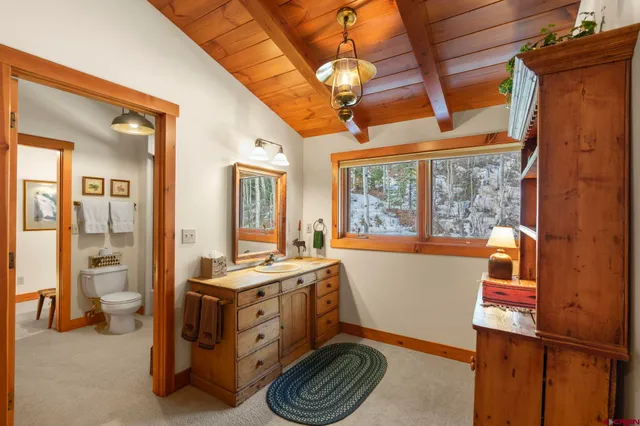 a bathroom with a shower a toilet and a shower