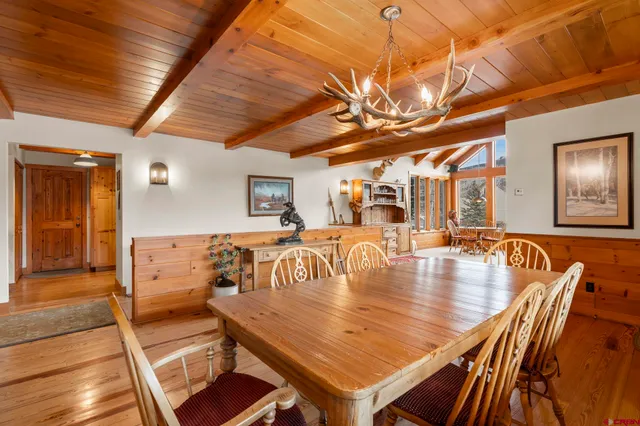 a room with lots of table and chairs