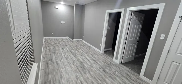 a white toilet sitting next to a bathroom sink