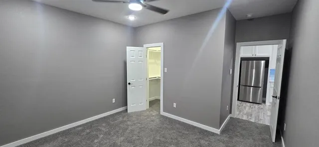 an empty room with closet area