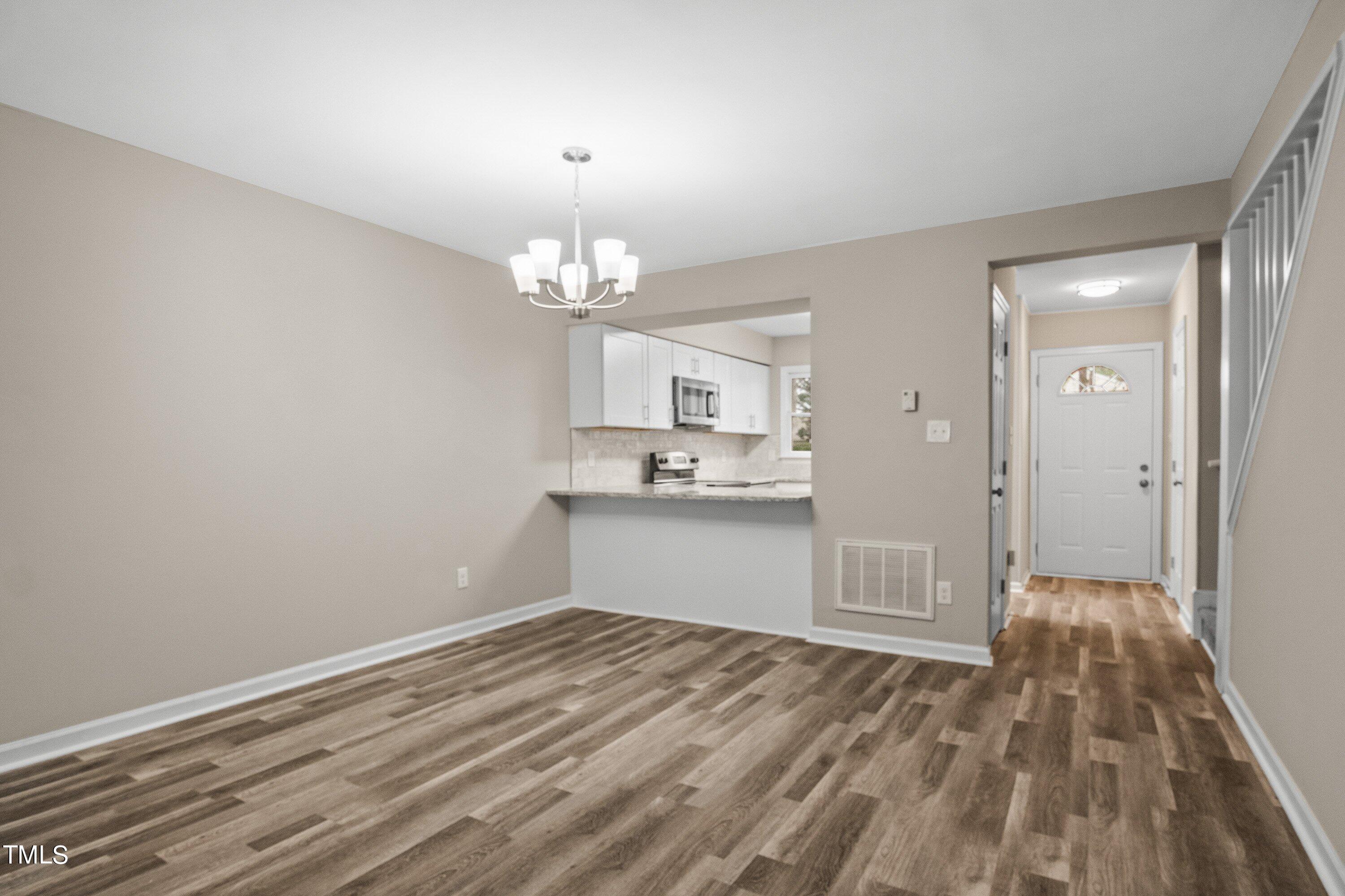 4440 Roller Court Raleigh, NC 27604 - Photo 13 of 38 a view of a kitchen with wooden floor and a sink