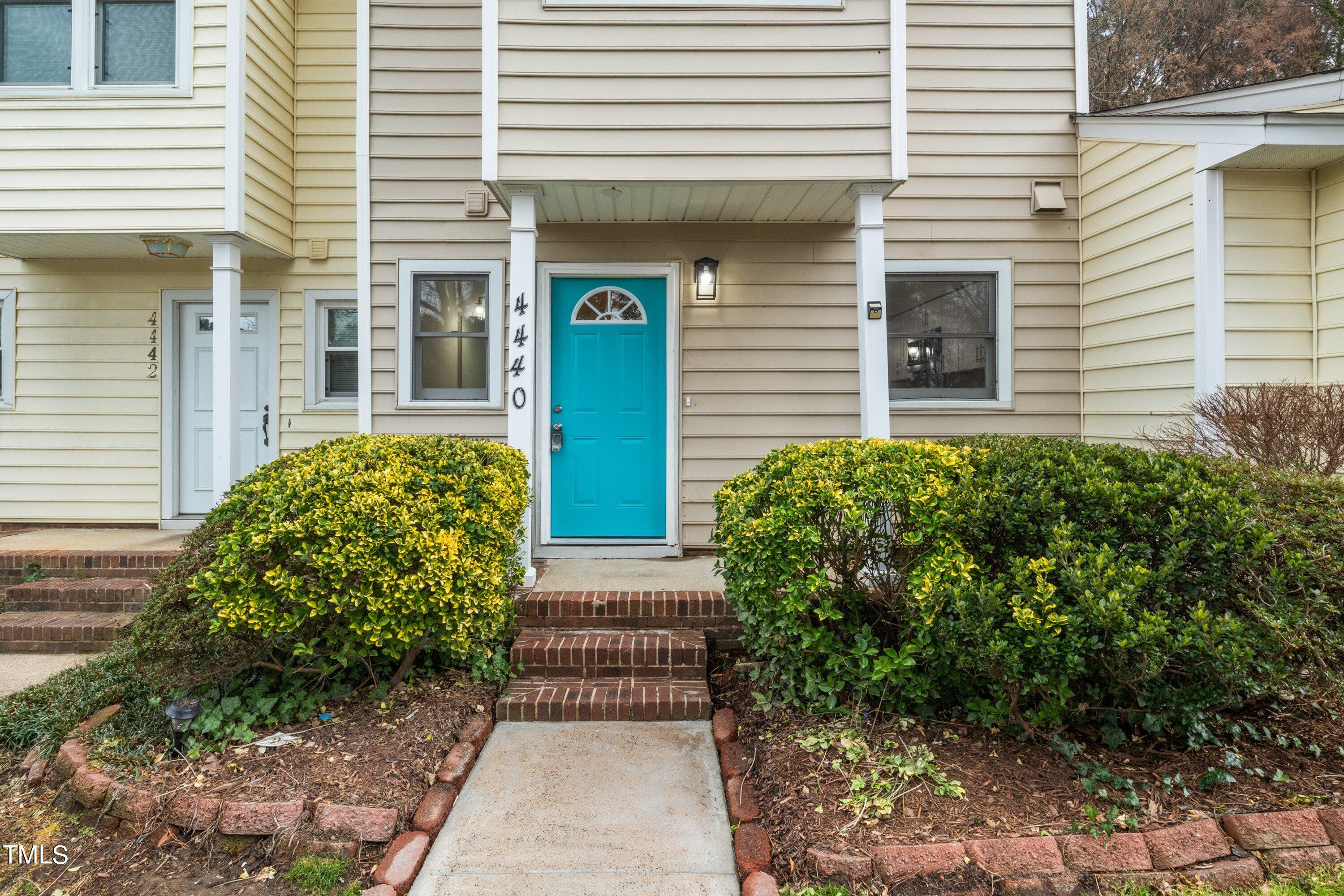 4440 Roller Court Raleigh, NC 27604 - Photo 2 of 38 a view of a house with potted plants