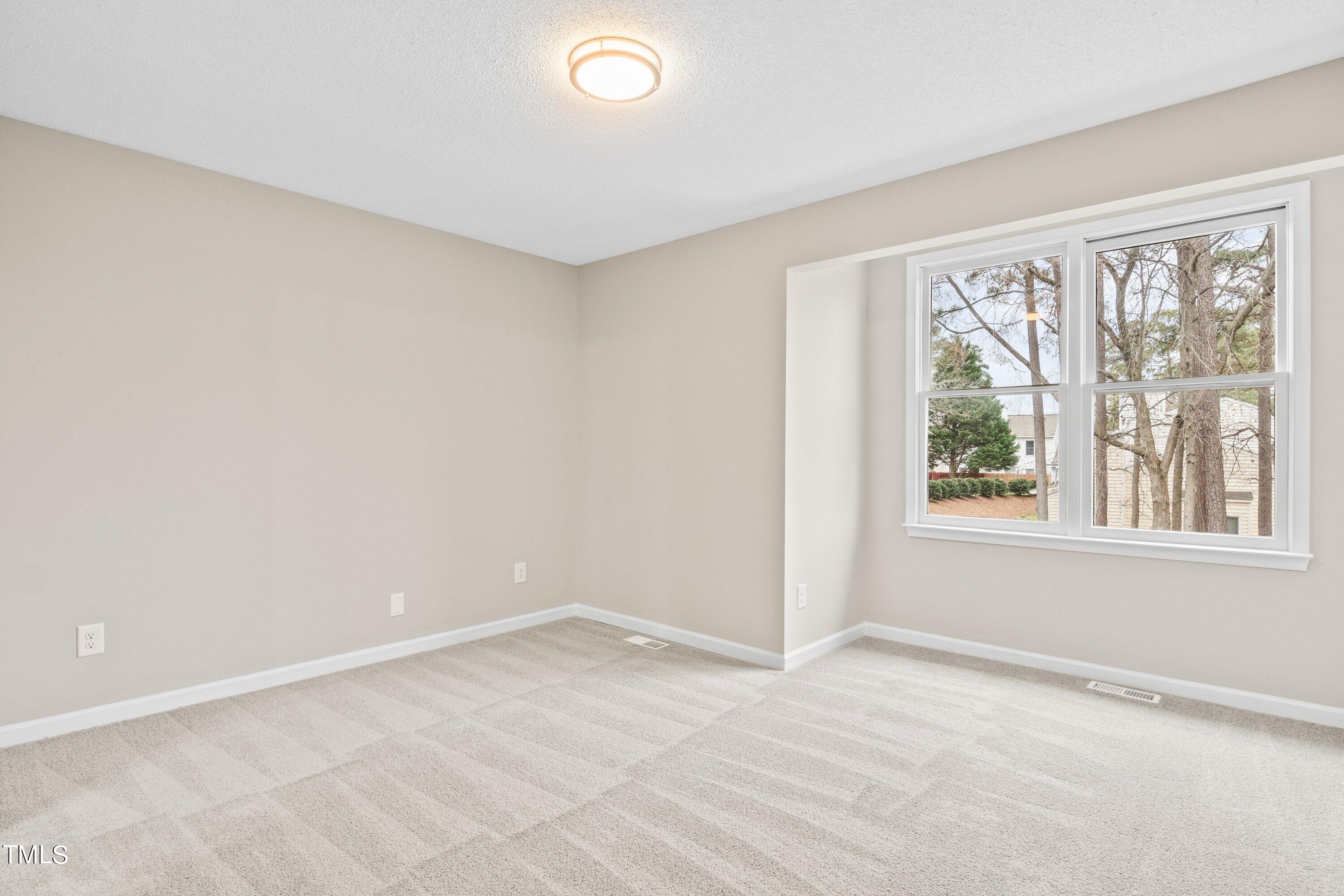 4440 Roller Court Raleigh, NC 27604 - Photo 24 of 38 an empty room with a window