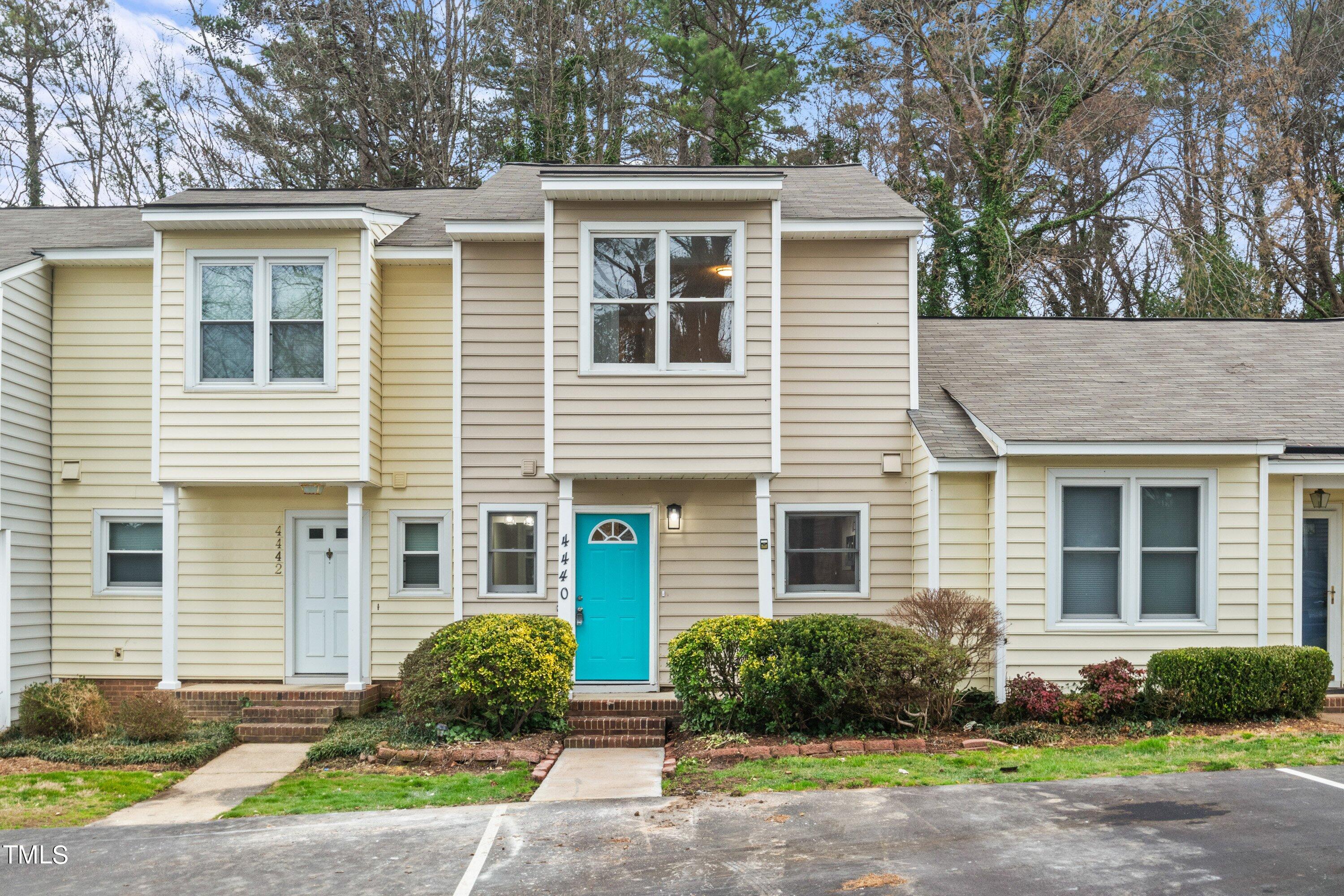4440 Roller Court Raleigh, NC 27604 - Photo 4 of 38 a front view of a house with garden