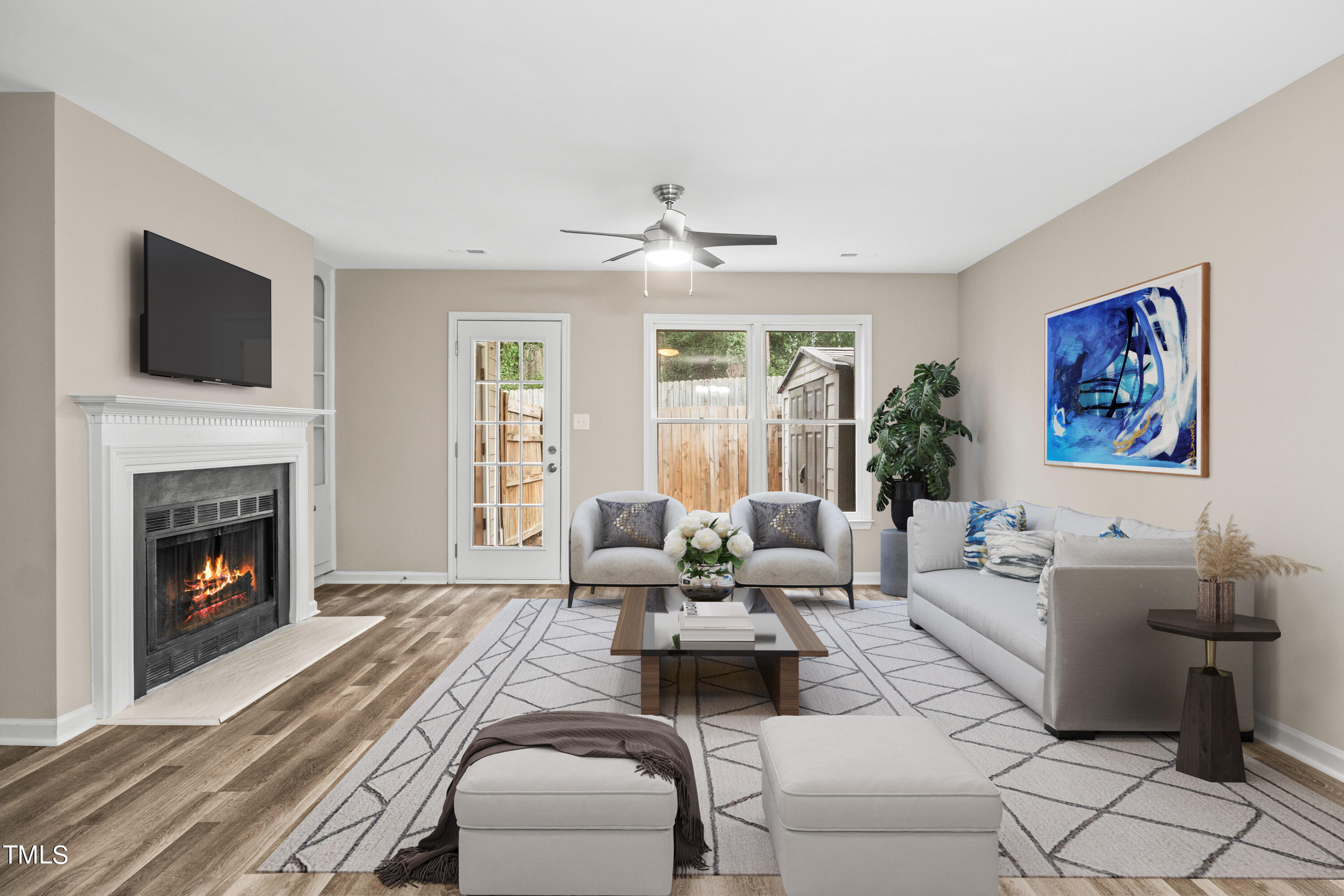 4440 Roller Court Raleigh, NC 27604 - Photo 5 of 38 a living room with furniture fireplace and flat screen tv