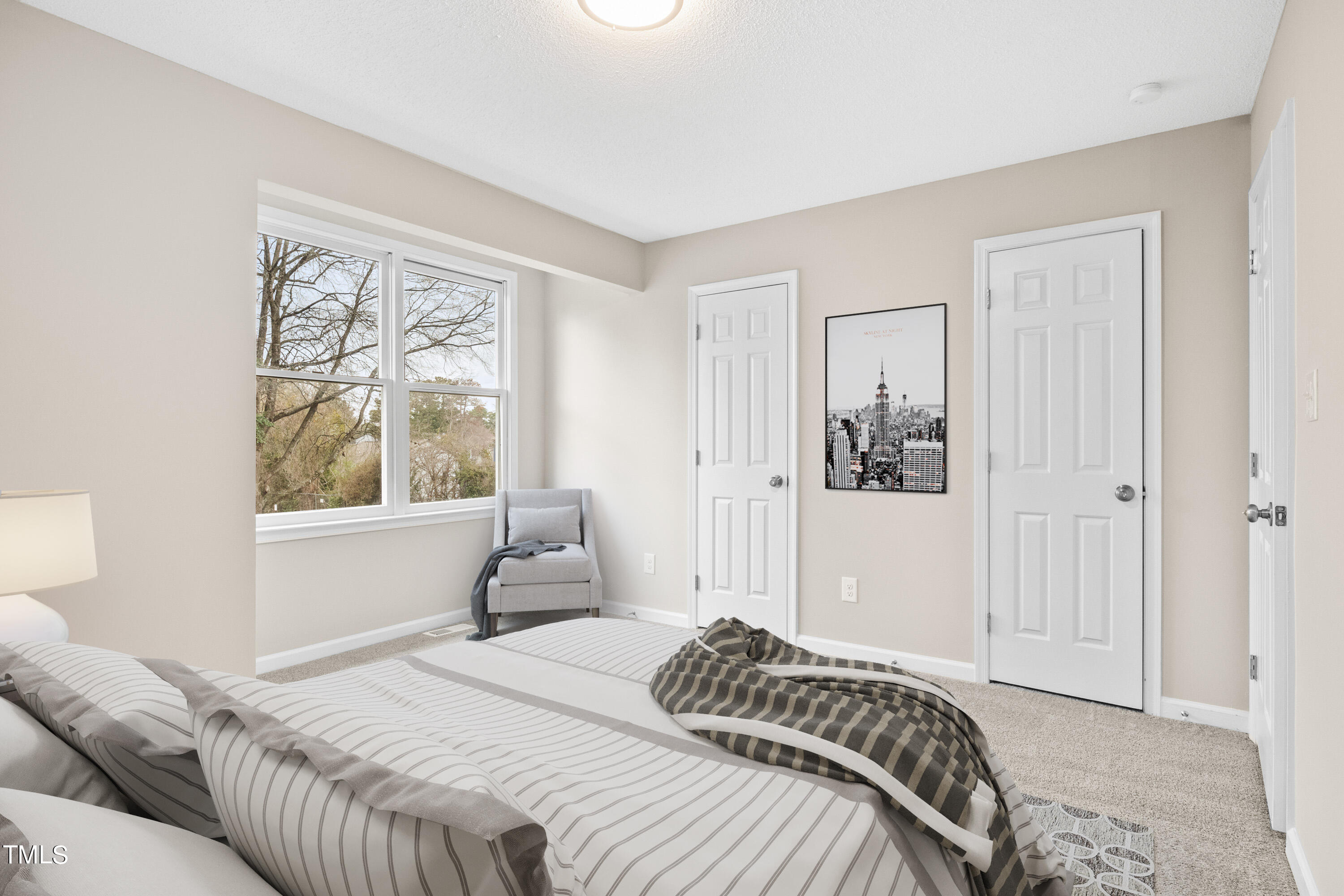 4440 Roller Court Raleigh, NC 27604 - Photo 7 of 38 a bedroom with a bed and a window