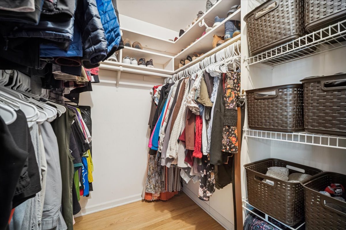 1718 South Ridge Drive Arlington Heights, IL 60005 - Photo 18 of 35 a view of walk in closet with clothes and shoes