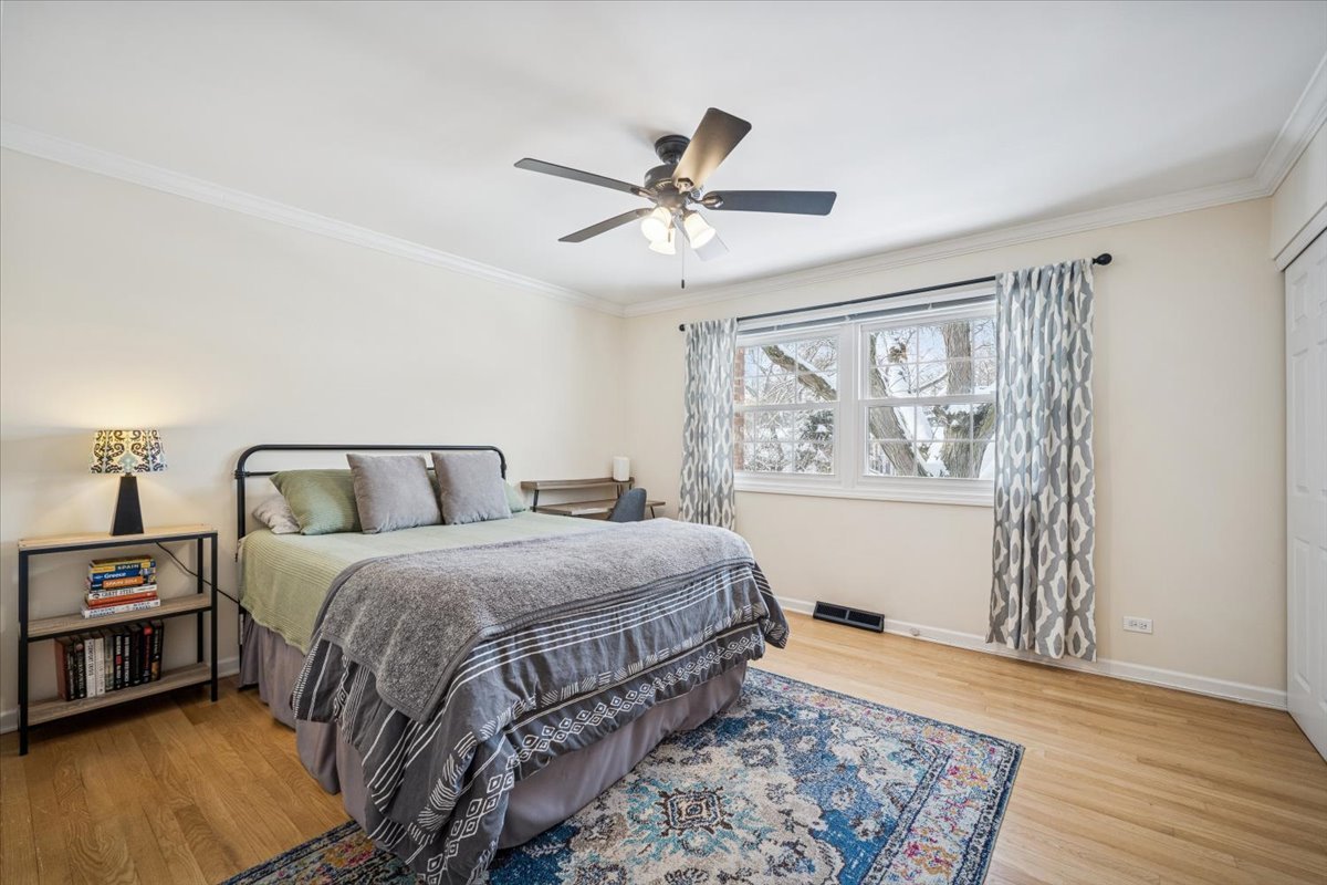 1718 South Ridge Drive Arlington Heights, IL 60005 - Photo 19 of 35 a bedroom with a bed and a window