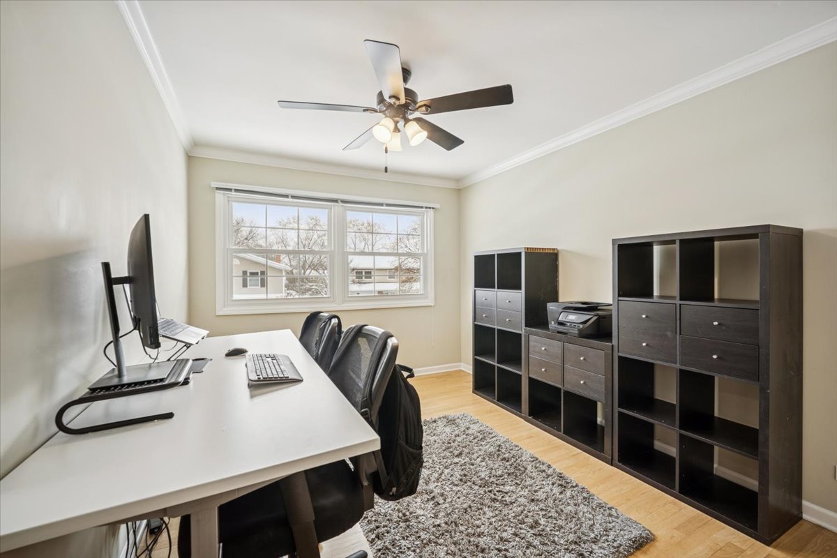 1718 South Ridge Drive Arlington Heights, IL 60005 - Photo 21 of 35 a view of a dining room with furniture window and wooden floor