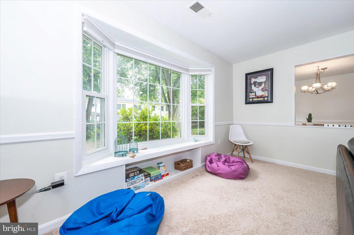 17305 Fletchall Road Poolesville, MD 20837 - Photo 11 of 51 a bath room with a table chair and a window