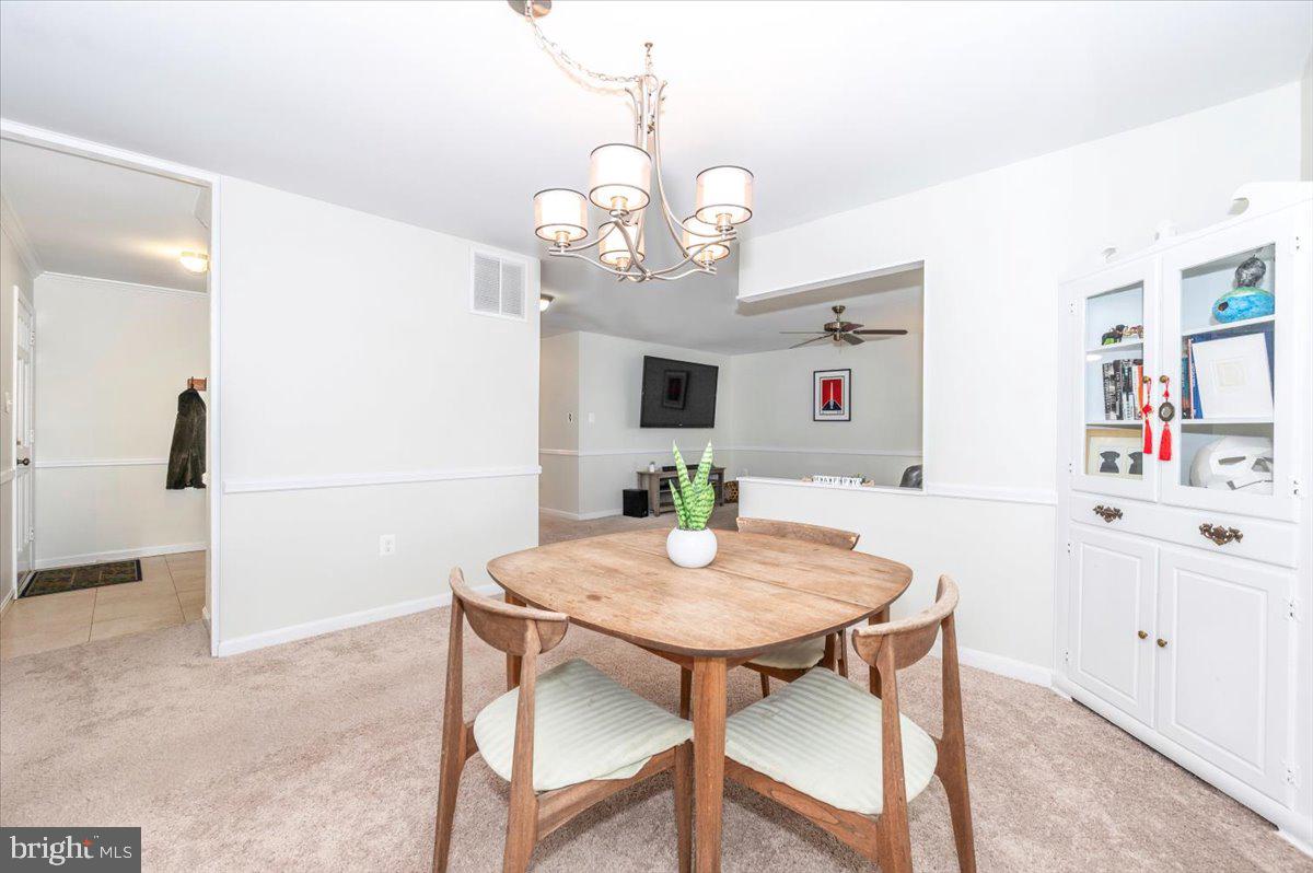 17305 Fletchall Road Poolesville, MD 20837 - Photo 14 of 51 a view of a dining room with furniture and wooden floor
