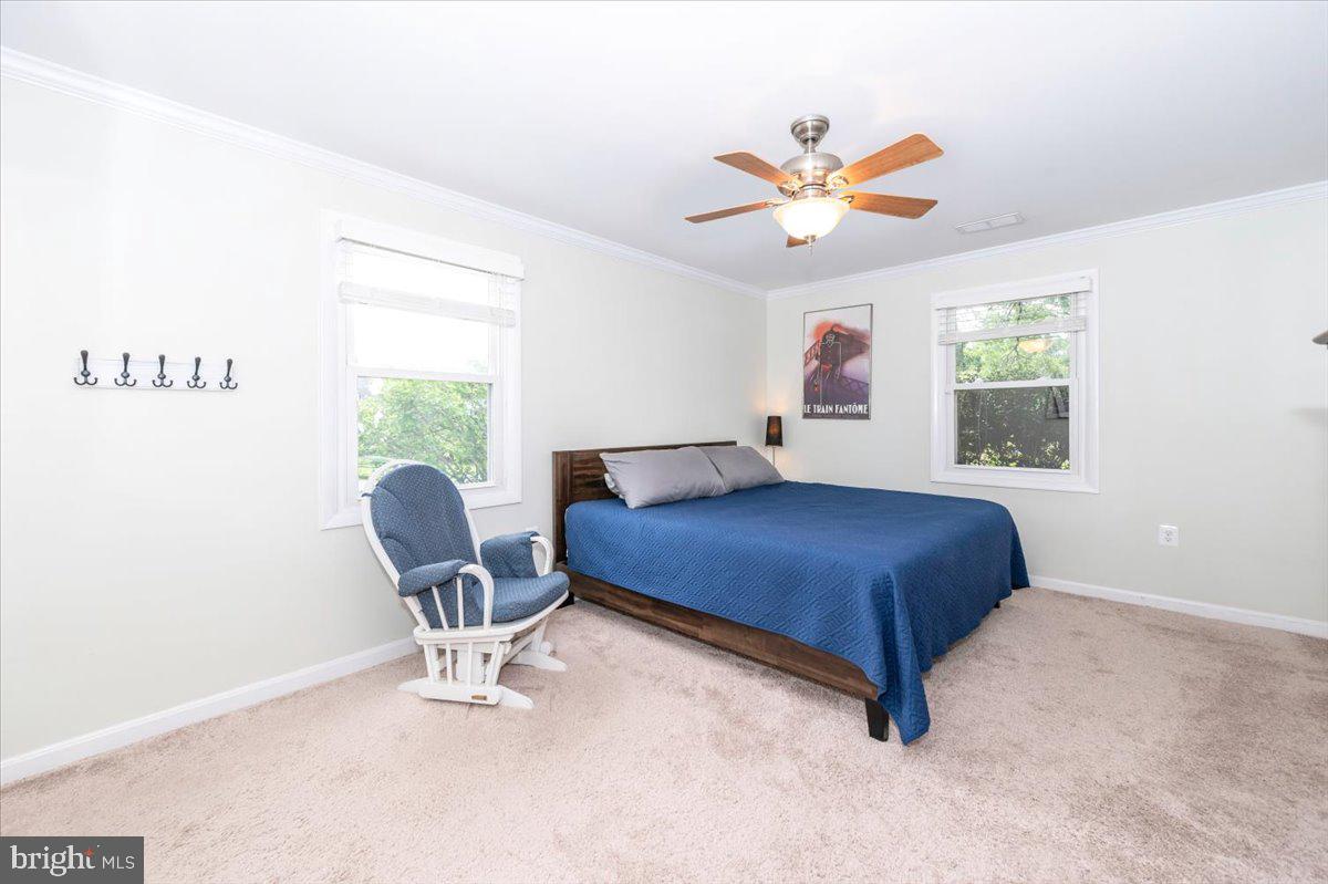 17305 Fletchall Road Poolesville, MD 20837 - Photo 20 of 51 a bedroom with a bed and a window