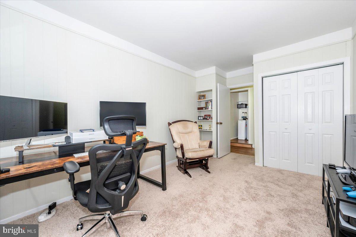 17305 Fletchall Road Poolesville, MD 20837 - Photo 30 of 51 a work room with furniture and a flat screen tv