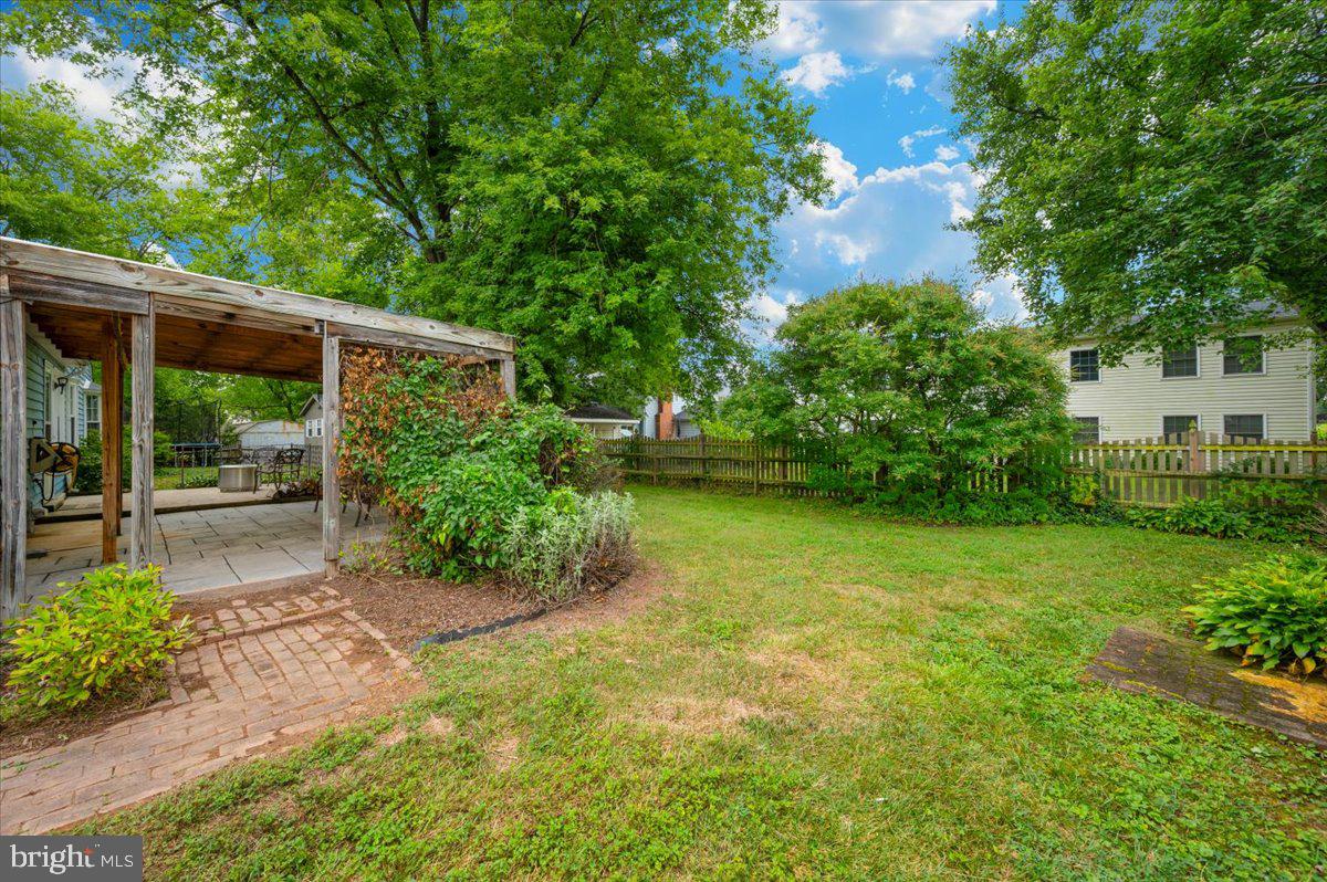 17305 Fletchall Road Poolesville, MD 20837 - Photo 31 of 51 a view of a backyard with plants and large trees