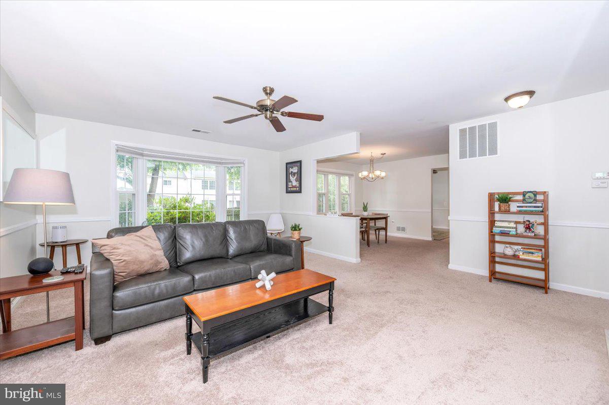 17305 Fletchall Road Poolesville, MD 20837 - Photo 8 of 51 a living room with furniture and a wooden floor