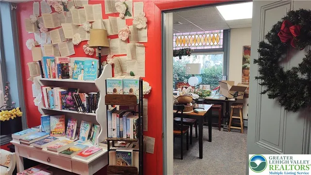 a outdoor living space with furniture and a book shelf