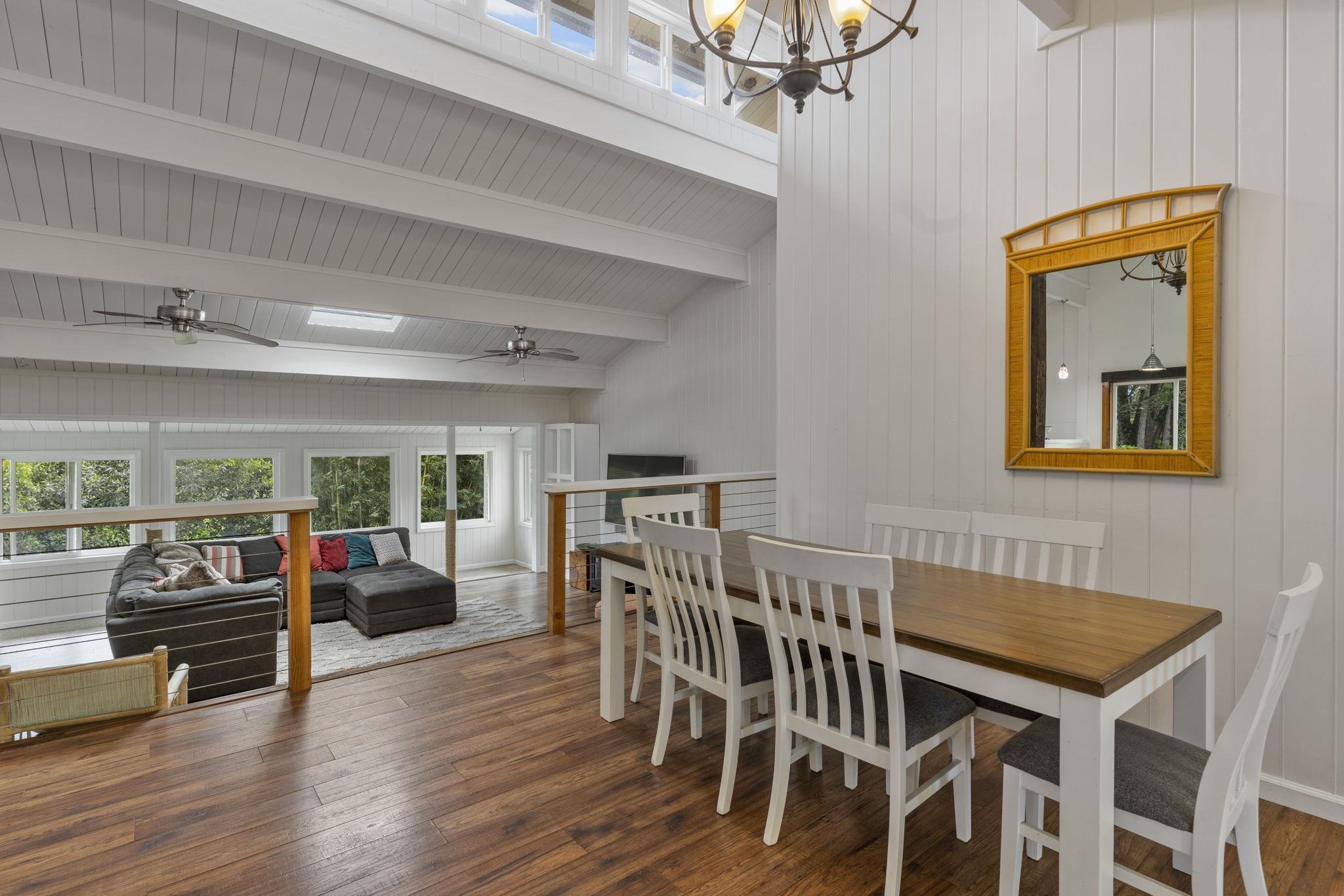 1515 Kaupakalua Road Haiku, HI 96708 - Photo 11 of 45 a view of a dining room with furniture wooden floor and chandelier