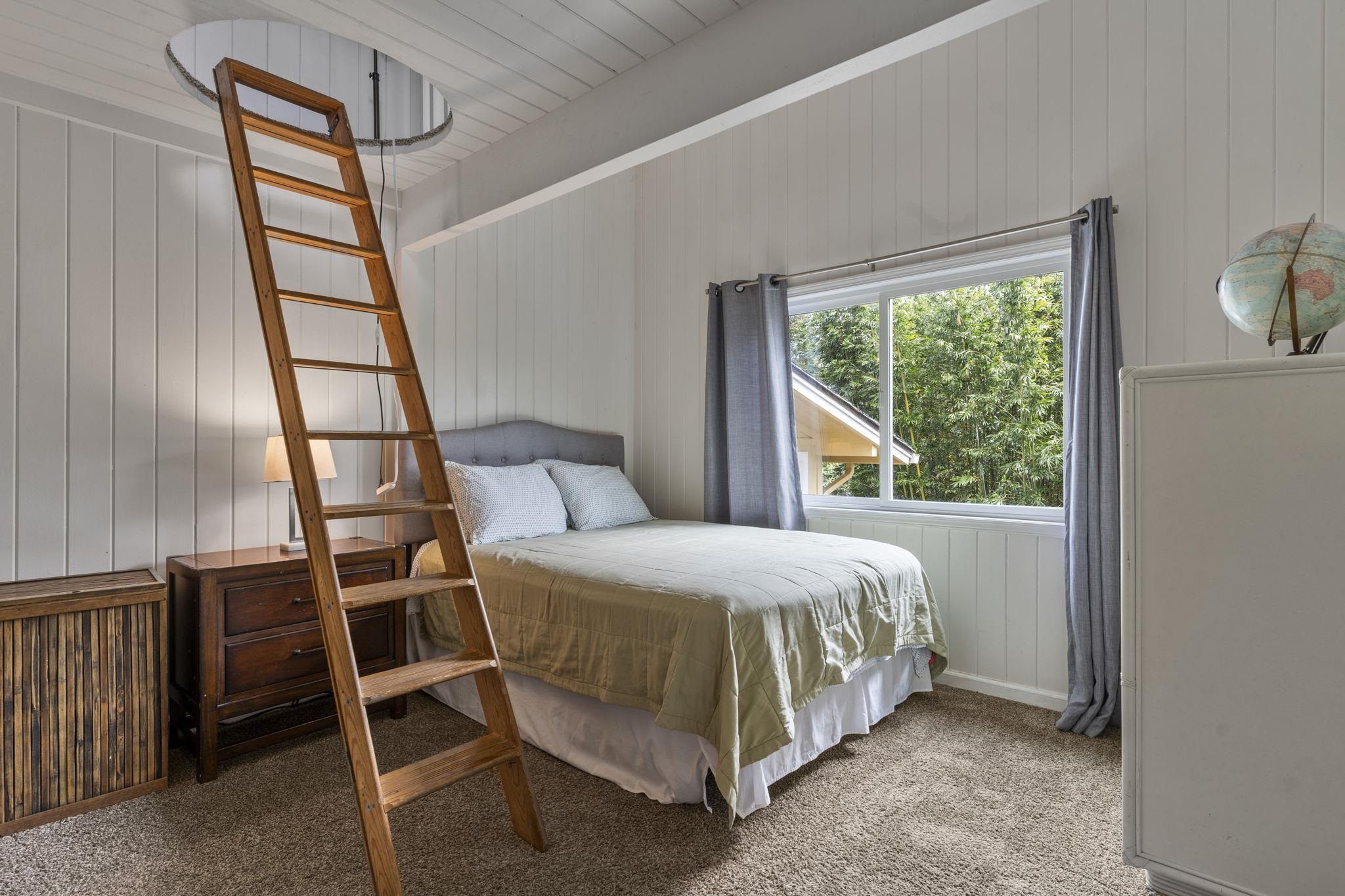 1515 Kaupakalua Road Haiku, HI 96708 - Photo 20 of 45 a bedroom with a bed and a window