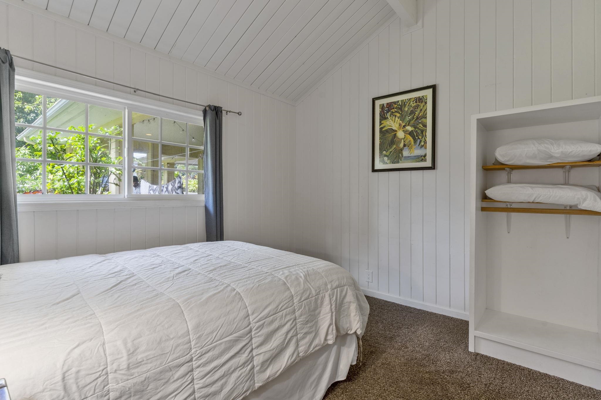 1515 Kaupakalua Road Haiku, HI 96708 - Photo 22 of 45 a bedroom with a bed and a window