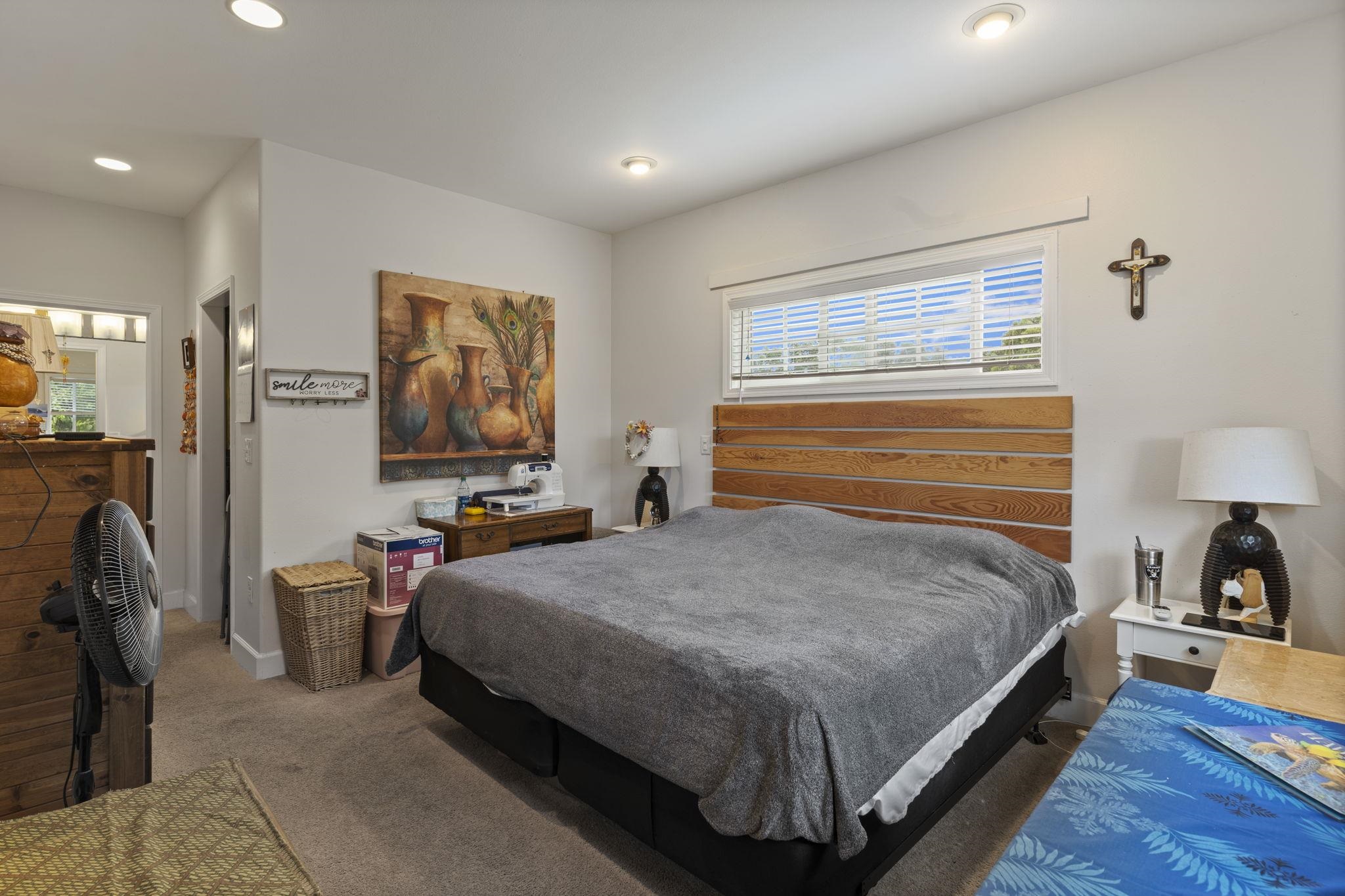 1515 Kaupakalua Road Haiku, HI 96708 - Photo 25 of 45 a bedroom with bed and a window