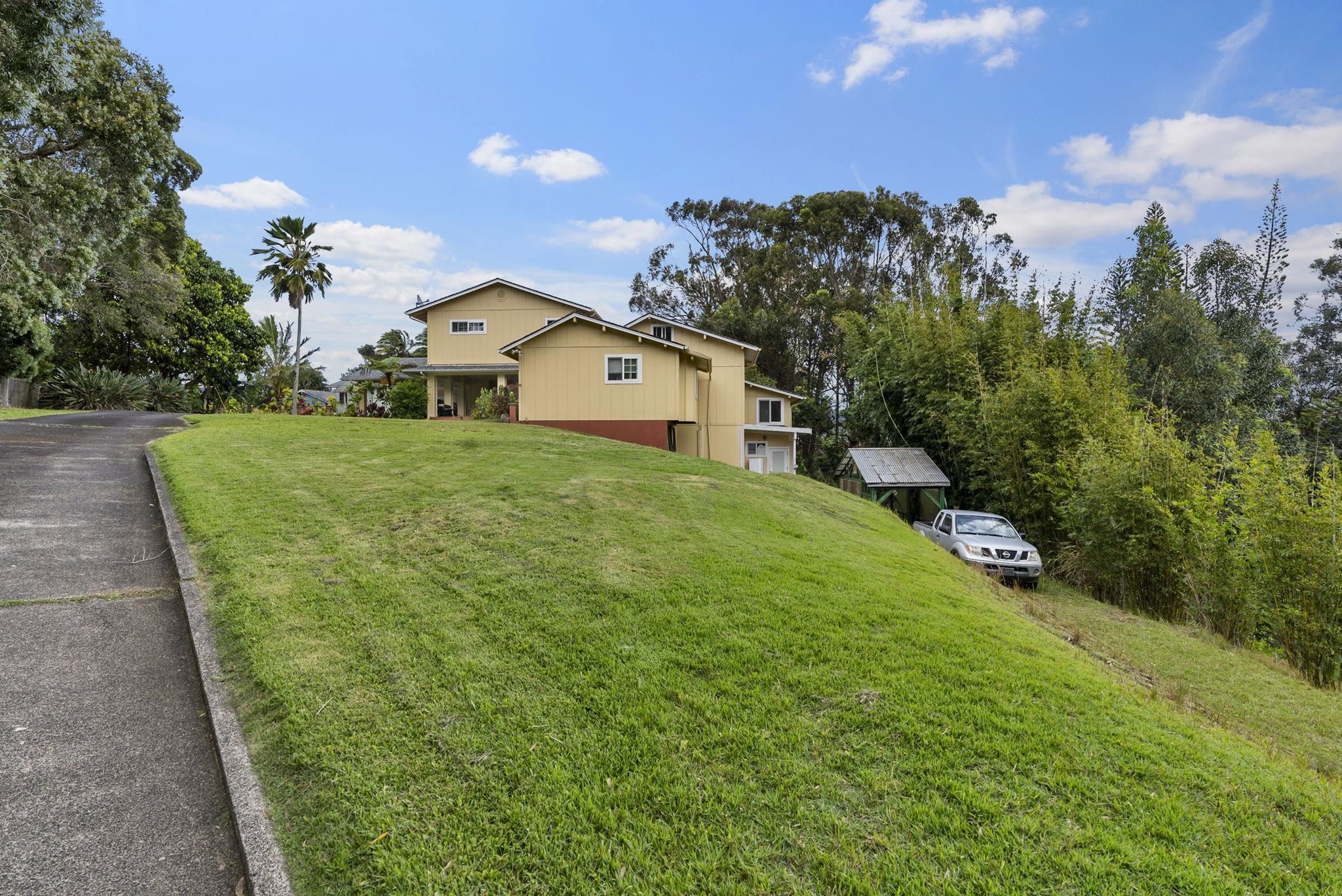 1515 Kaupakalua Road Haiku, HI 96708 - Photo 33 of 45 a view of a house with a yard