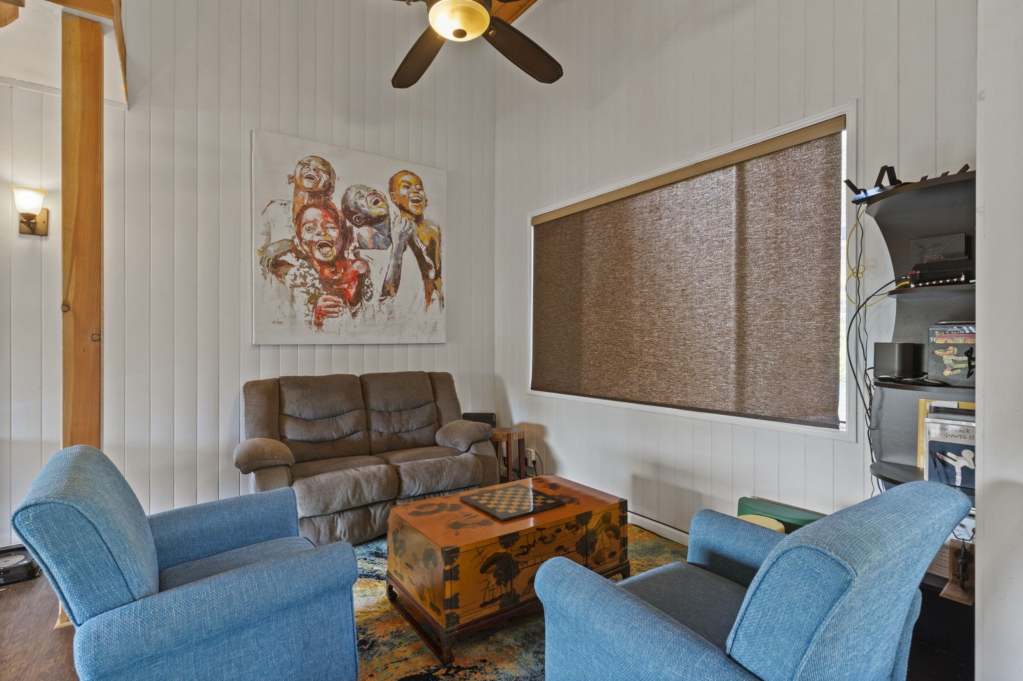 1515 Kaupakalua Road Haiku, HI 96708 - Photo 38 of 45 a living room with furniture a couch and a flat screen tv