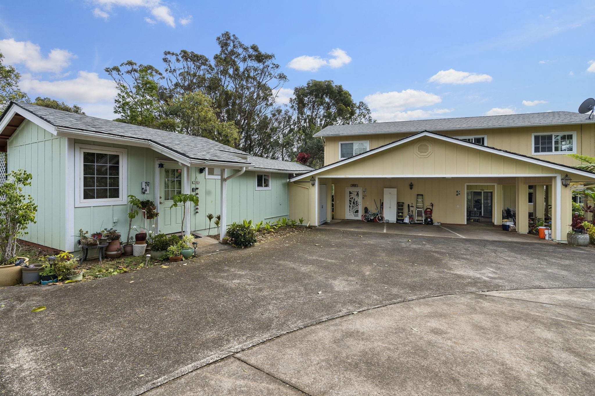 1515 Kaupakalua Road Haiku, HI 96708 - Photo 6 of 45 a front view of a house with garden