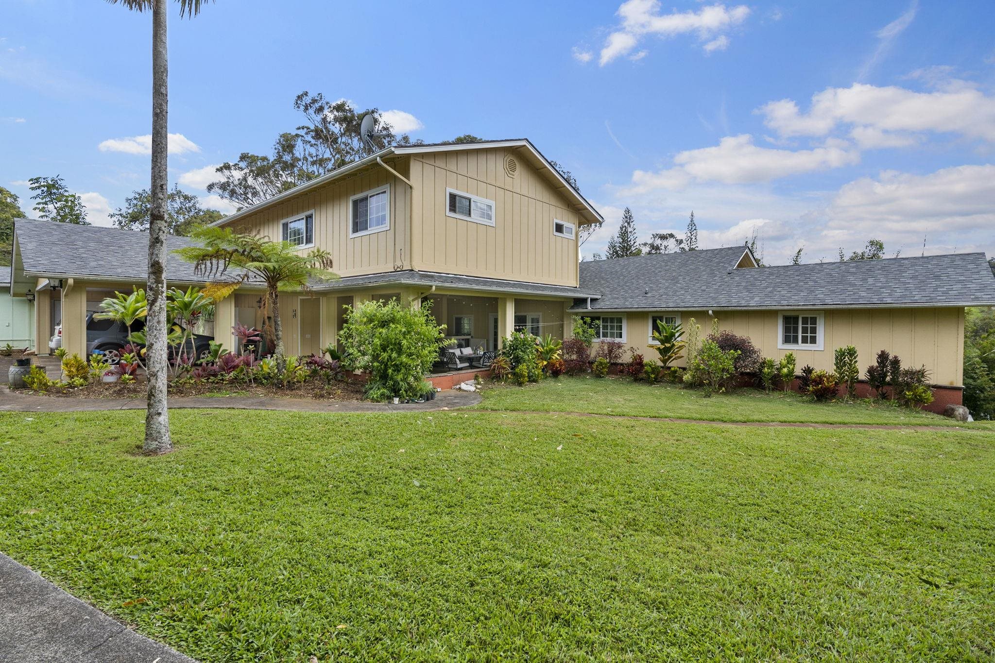 1515 Kaupakalua Road Haiku, HI 96708 - Photo 8 of 45 a front view of a house with a yard