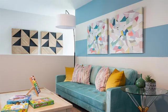 a bedroom with two beds and a chandelier