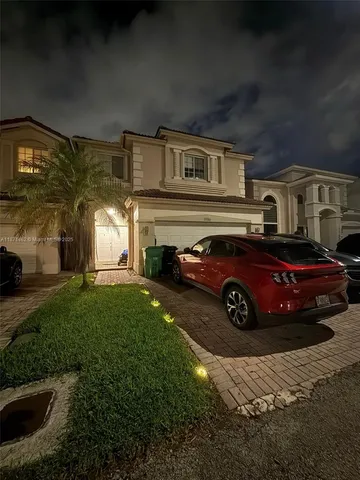 a view of a car in front of house
