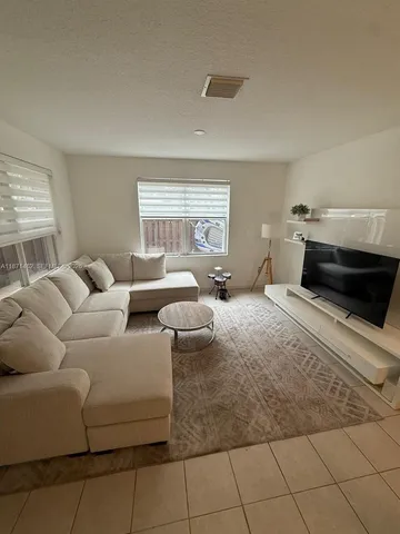 a bedroom with furniture and a fireplace