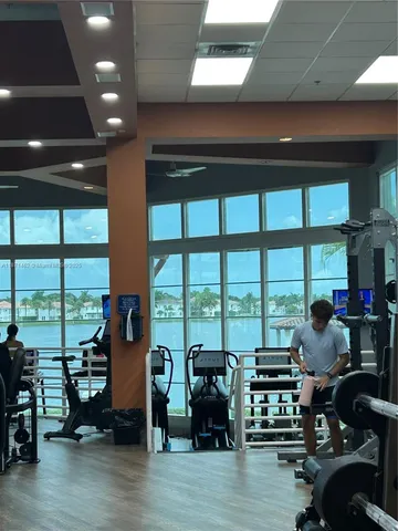 a view of a dining room with furniture wooden floor and chandelier