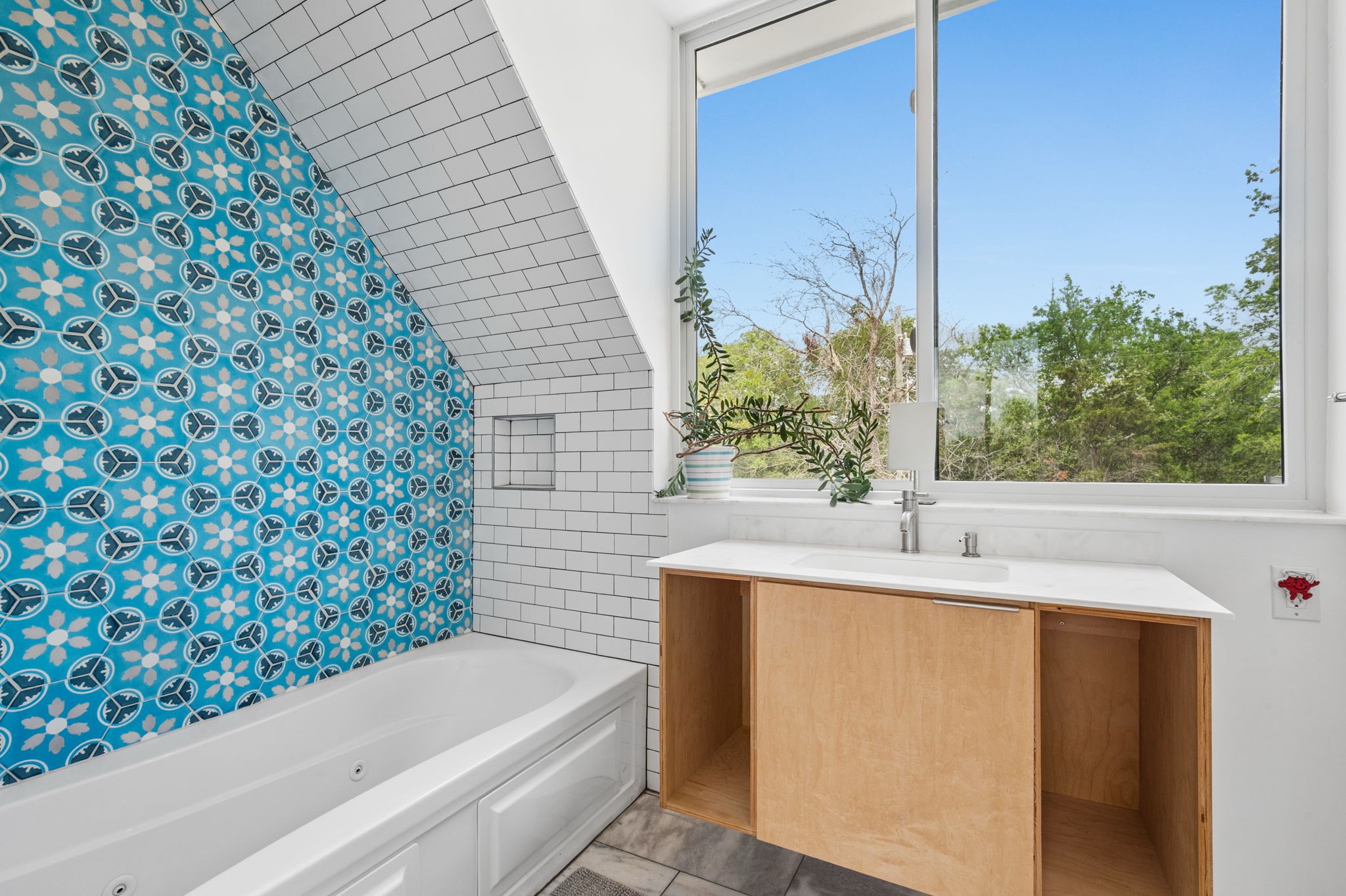 534 Old McDade Road Elgin, TX 78621 - Photo 27 of 40 Tile locally sourced from Clay imports, marble counters and windowsill, as well as a soaking tub.