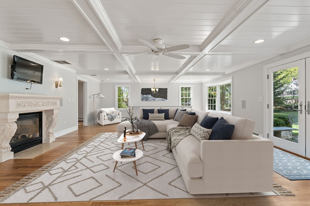 59 Standish Road Wellesley, MA 02481 - Photo 11 of 31 a living room with furniture a fireplace and a flat screen tv