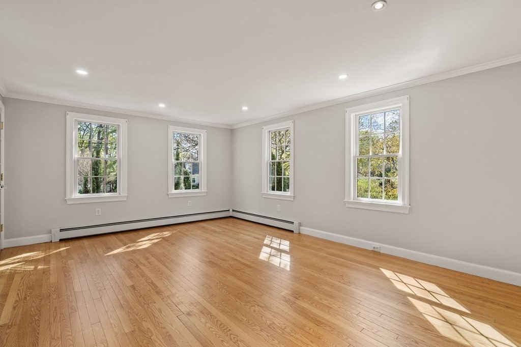 59 Standish Road Wellesley, MA 02481 - Photo 19 of 31 an empty room with wooden floor and windows