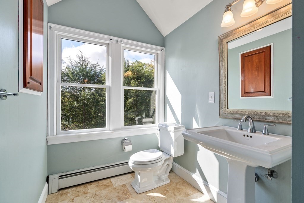 59 Standish Road Wellesley, MA 02481 - Photo 20 of 31 a bathroom with a toilet sink and mirror
