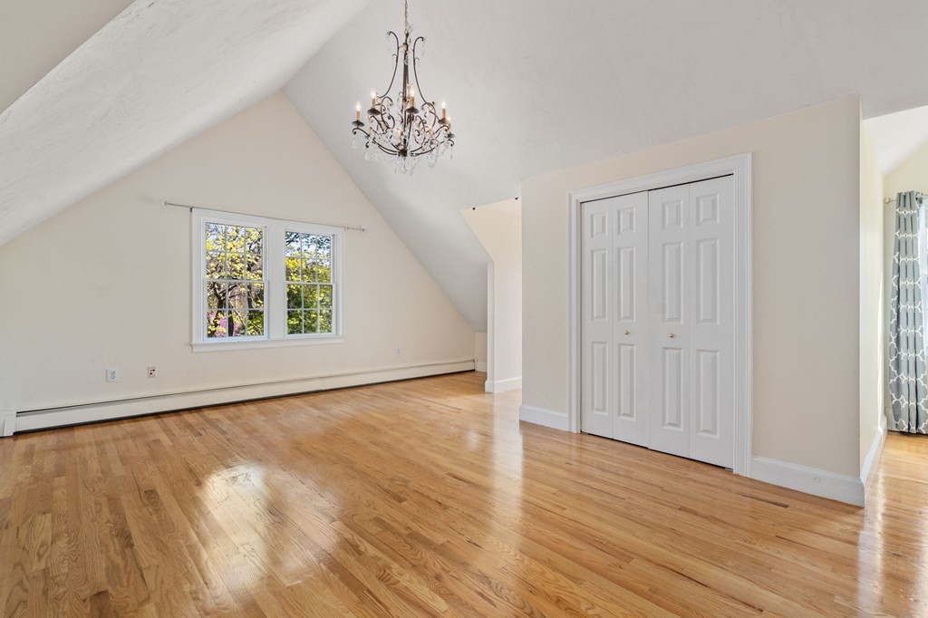 59 Standish Road Wellesley, MA 02481 - Photo 21 of 31 a view of an empty room with wooden floor and a window