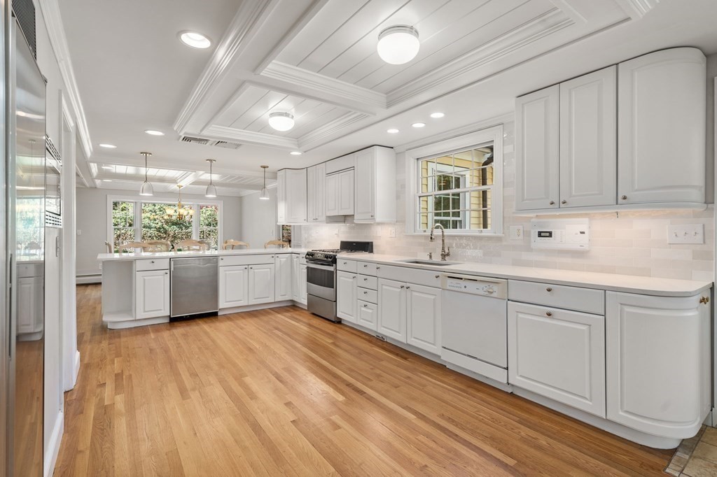 59 Standish Road Wellesley, MA 02481 - Photo 7 of 31 a kitchen with white cabinets and white appliances