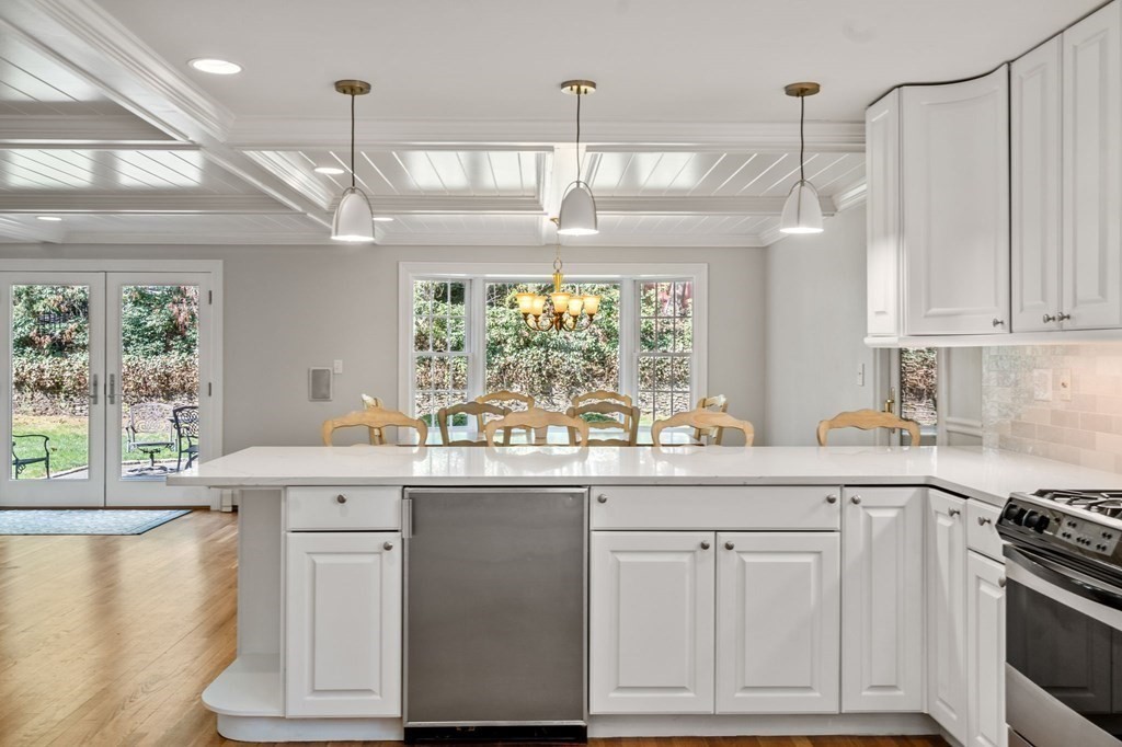 59 Standish Road Wellesley, MA 02481 - Photo 9 of 31 a kitchen with kitchen island granite countertop a sink and a stove