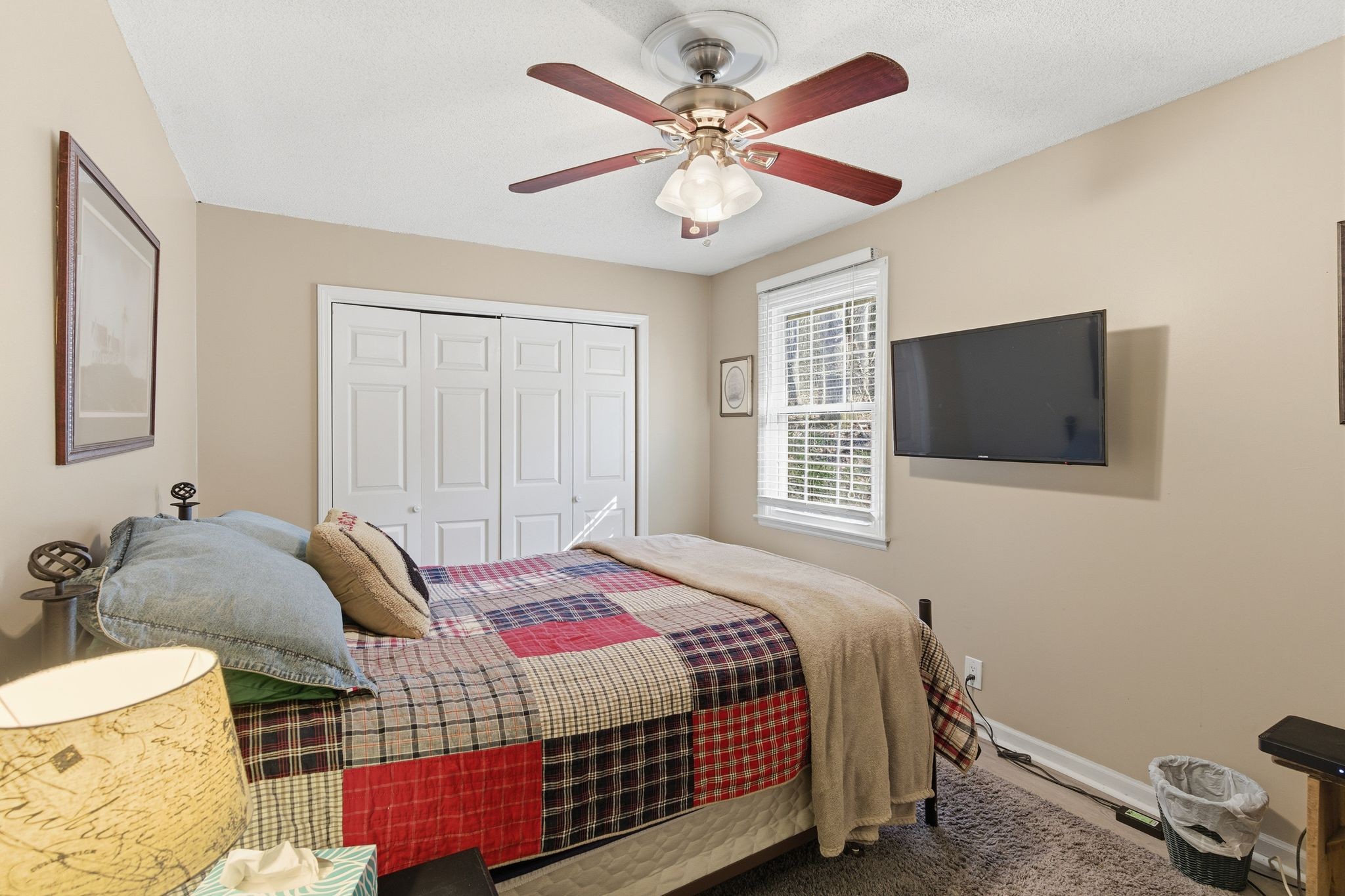 8073 Ridgewood Road Goodlettsville, TN 37072 - Photo 17 of 38 a bedroom with a bed and a chandelier