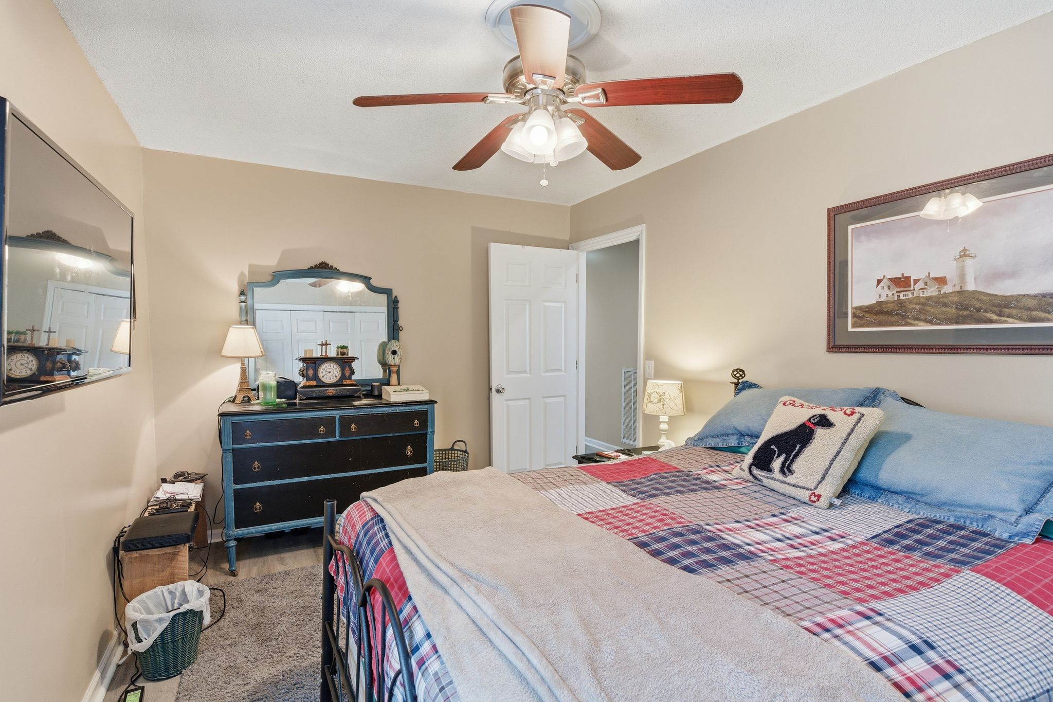 8073 Ridgewood Road Goodlettsville, TN 37072 - Photo 18 of 38 a bedroom with a bed and a chandelier