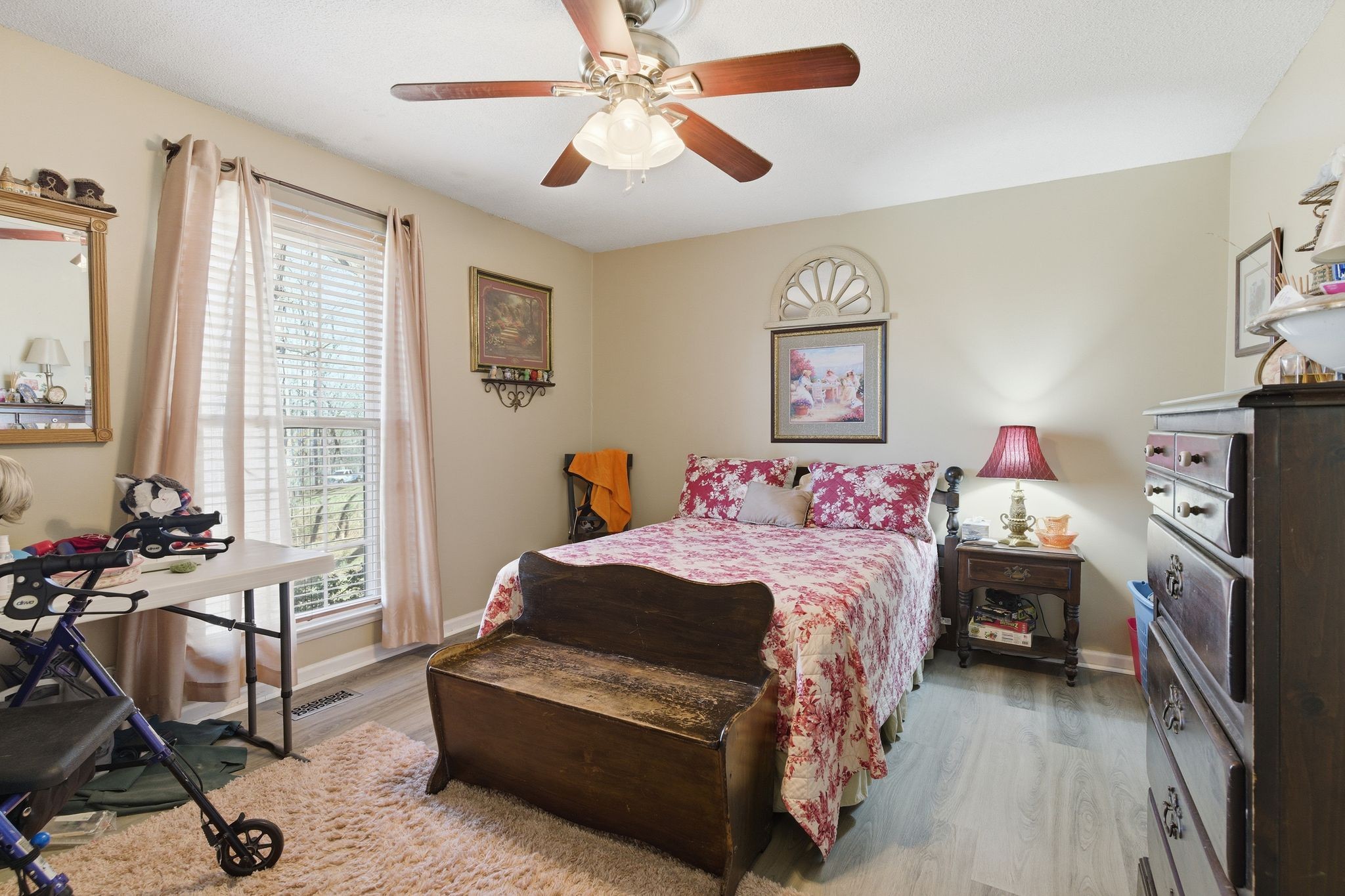 8073 Ridgewood Road Goodlettsville, TN 37072 - Photo 19 of 38 a bedroom with a bed and a chandelier