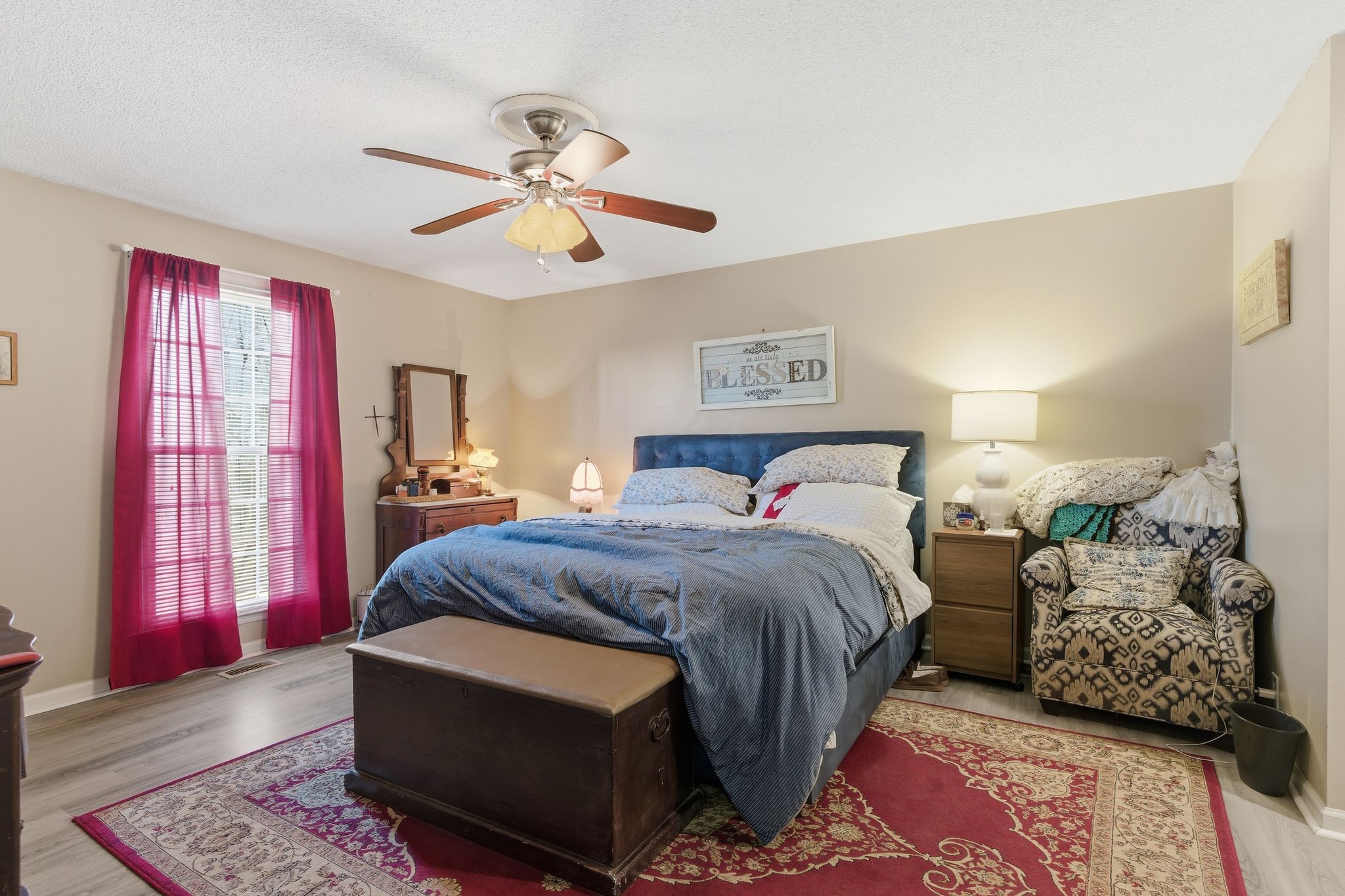 8073 Ridgewood Road Goodlettsville, TN 37072 - Photo 21 of 38 a bedroom with a bed and a chandelier