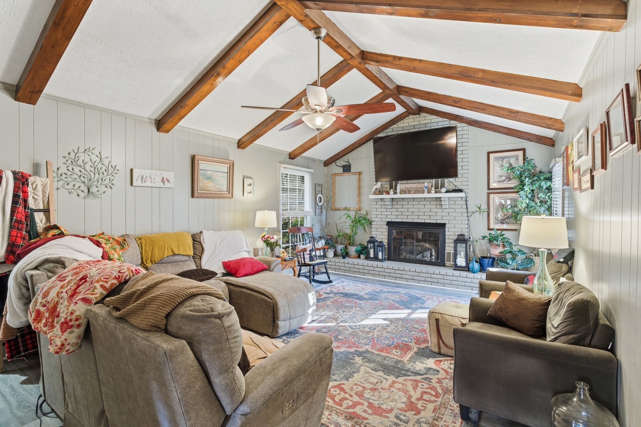 8073 Ridgewood Road Goodlettsville, TN 37072 - Photo 26 of 38 a living room with furniture a fireplace and a flat screen tv