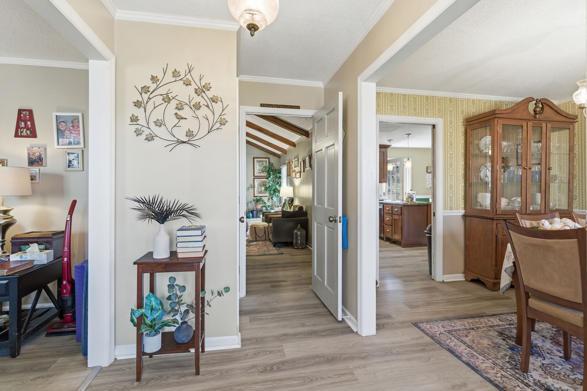 8073 Ridgewood Road Goodlettsville, TN 37072 - Photo 4 of 38 a view of a hallway with wooden floor and a living room