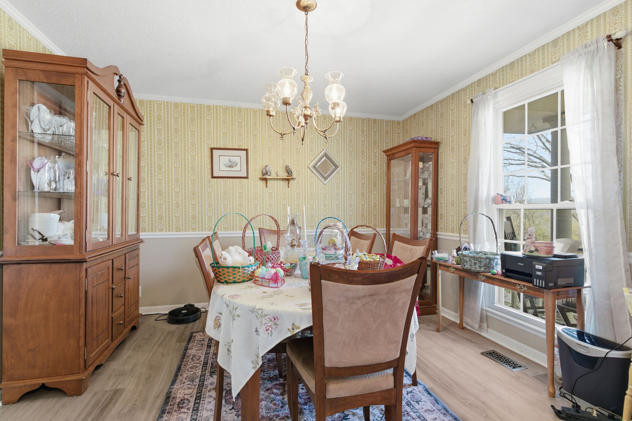 8073 Ridgewood Road Goodlettsville, TN 37072 - Photo 6 of 38 a dining room with furniture a chandelier and wooden floor