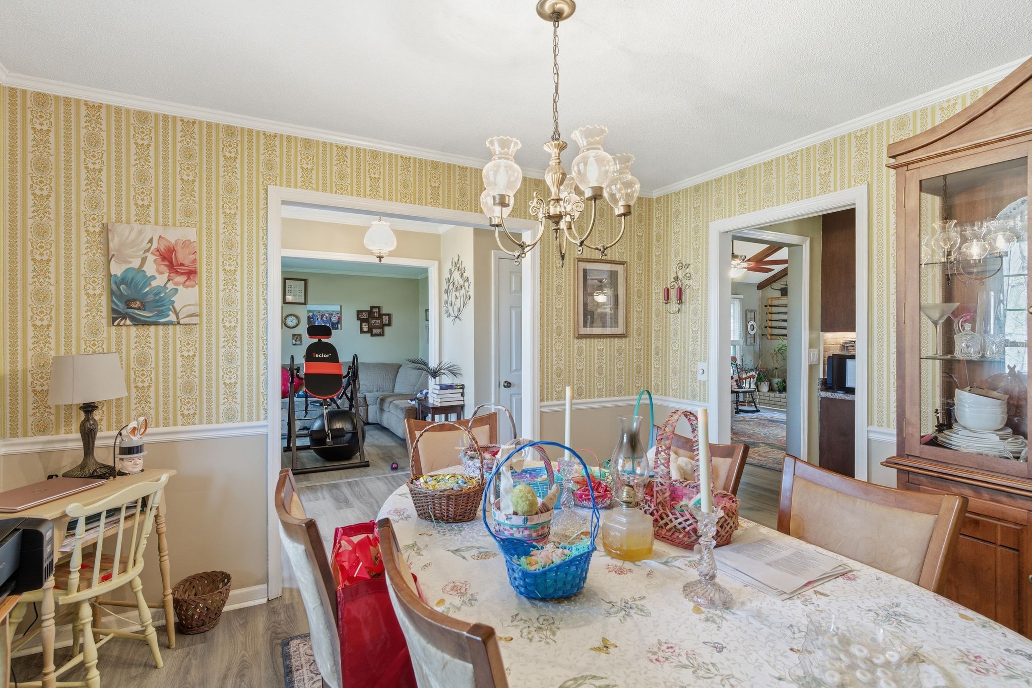 8073 Ridgewood Road Goodlettsville, TN 37072 - Photo 7 of 38 a dining room with furniture a chandelier and wooden floor