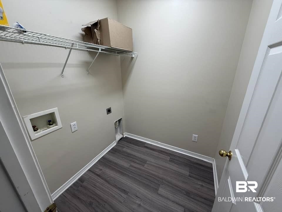 2651 South Juniper Street, Unit 401 Foley, AL 36535 - Photo 11 of 27 Laundry area with hookup for a washing machine, laundry area, hookup for an electric dryer, baseboards, and dark wood-type flooring