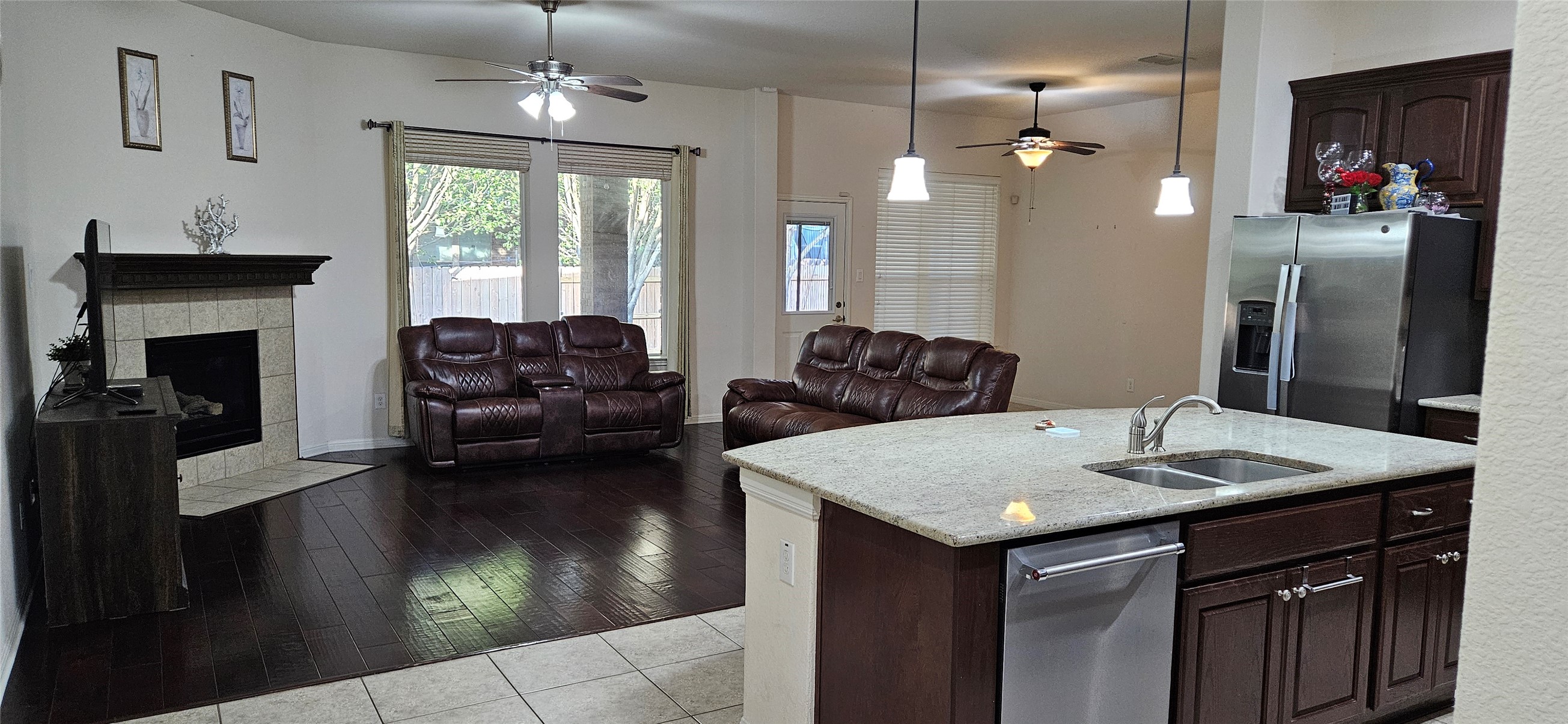 116 Azimuth Drive Austin, TX 78717 - Photo 29 of 33 a kitchen with a sink dishwasher a dining table and chairs with wooden floor