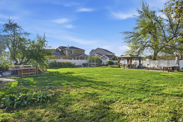1095 Park Avenue Logan, UT 84321 - Photo 19 of 27 Fenced backyard with a gazebo and a patio area